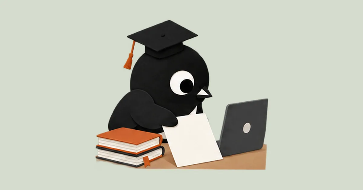 The Twoweeks bird in a graduation cap places a sheet of paper on a desk with a laptop and notebooks.